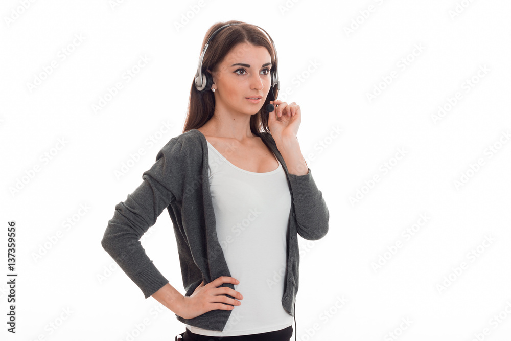 young beauty business lady with headphone and microphone in uniform isolated on white background young beauty business lady with headphone and microphone in uniform isolated on white background