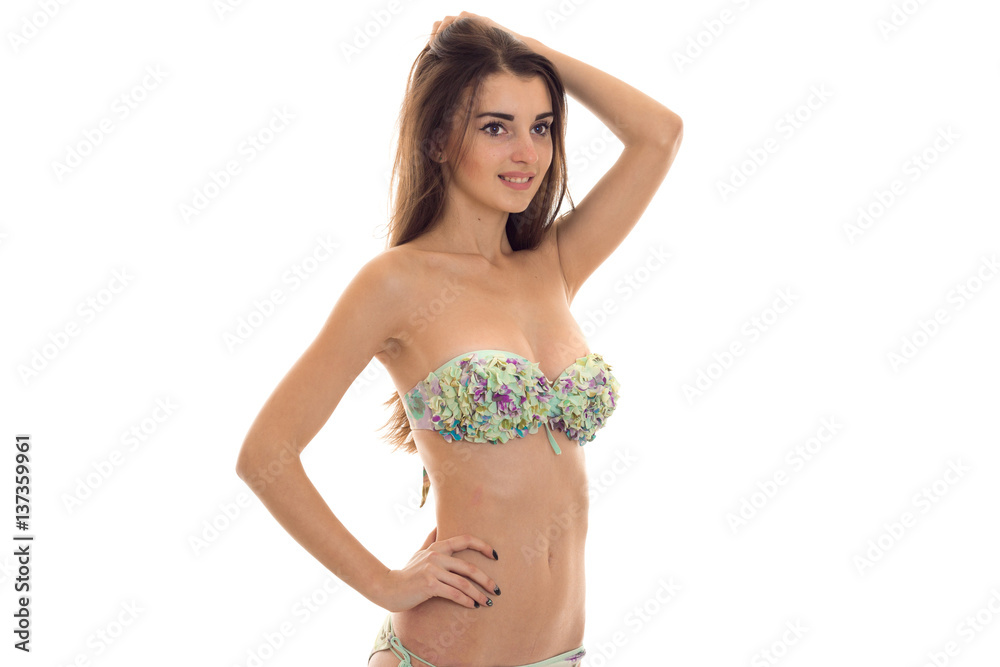 beautiful slim young lady with big natural breasts in swimsuit with floral  pattern smiling isolated on white background Stock Photo | Adobe Stock