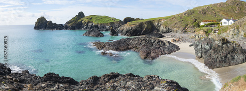 Kynance Cove on the Lizard Peninsula, Cornwall in England, UK. An important site for geologists because of the serpentine rock cliffs. photo