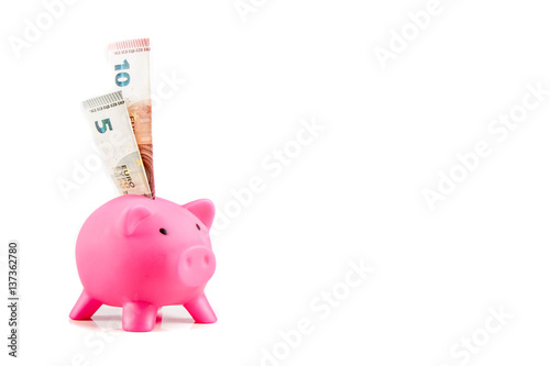 Piggybank with ten and five Euro banknotes