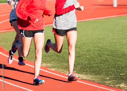 Running partners training on a track