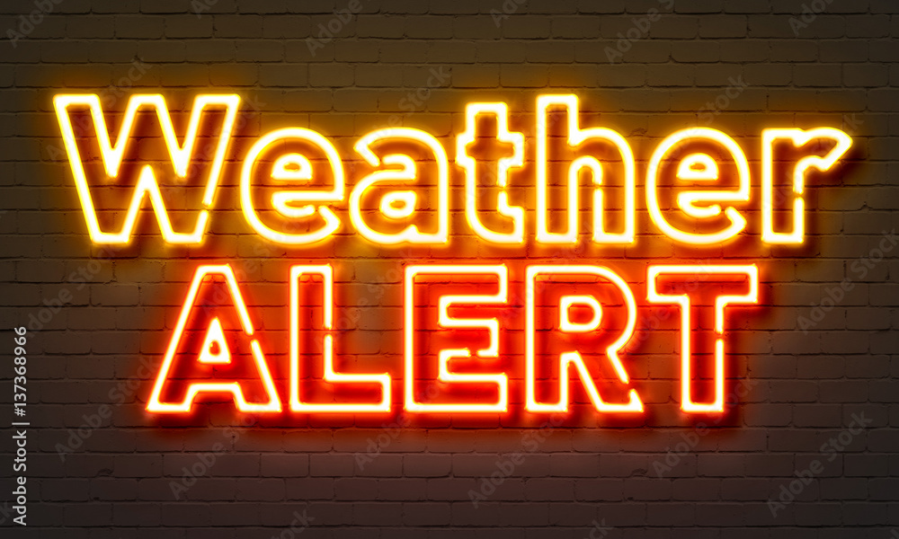 Weather alert neon sign on brick wall background. Weather alert neon sign on brick wall background.