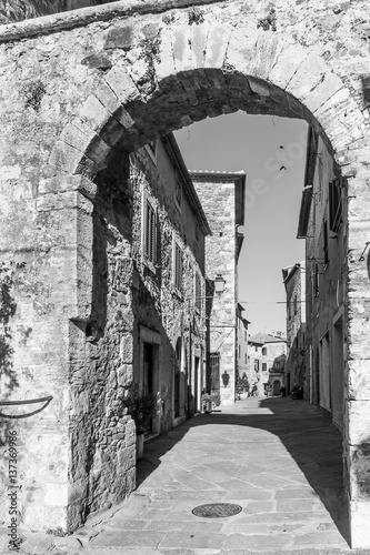The ancient stone door that marks the entrance to the historic center of Montemerano  Grosseto  Tuscany  Italy