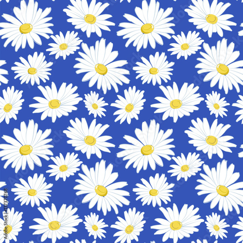 Seamless pattern with white daisies on a blue background. © Tetiana
