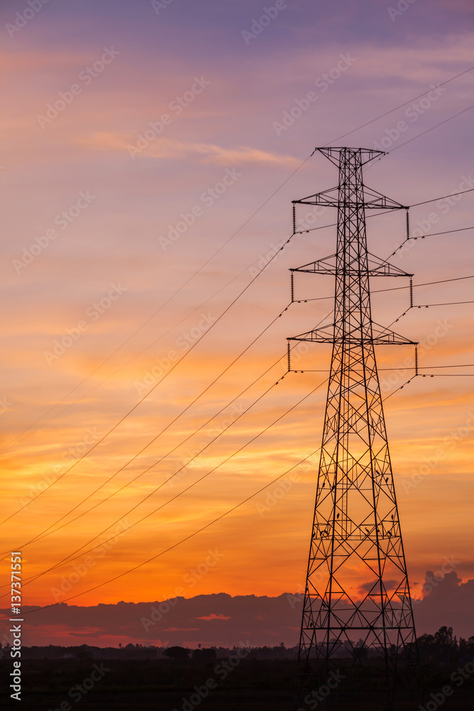 Electric pole at sunset twilight landscape