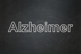 Health concept: Alzheimer on chalkboard background