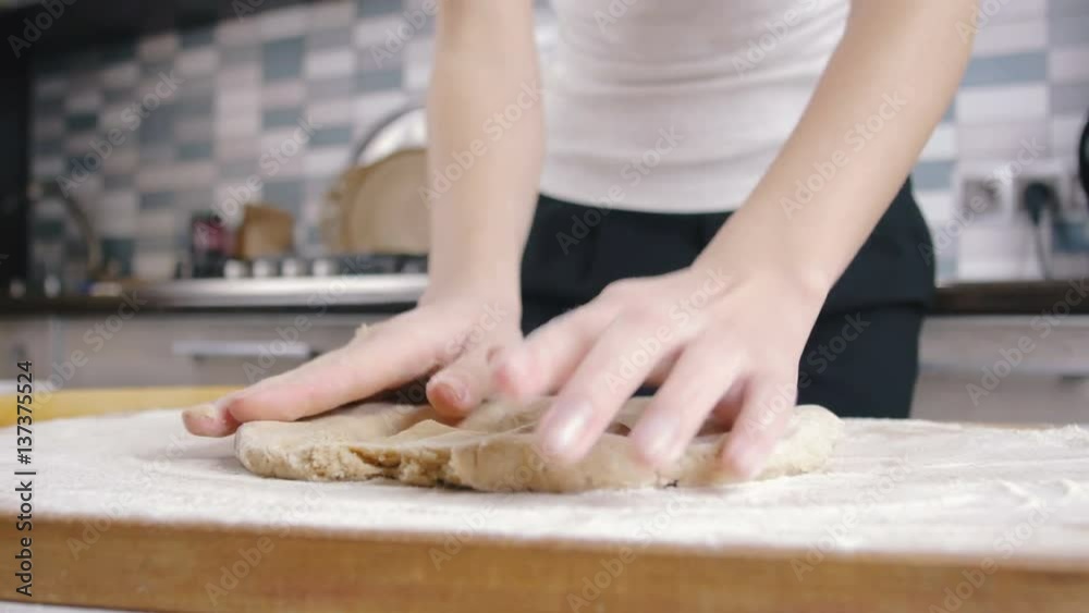 Making dough by female hands at home, slow motion Making dough by female hands at home, slow motion