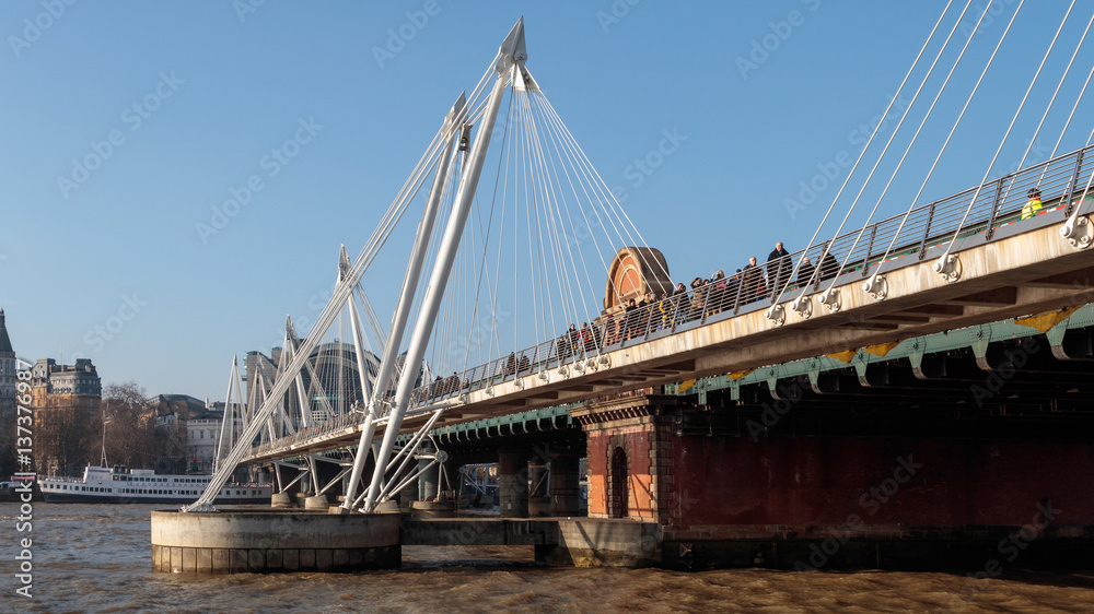 People Crossing Hungerford Bridge People Crossing Hungerford Bridge