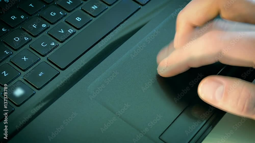 Close-Up Male Hand Using Touchpad on the Laptop Close-Up Male Hand Using Touchpad on the Laptop