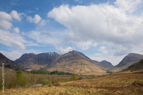 Snow topped mountains Glencoe Scotland UK famous tourist destination in Lochaber Scottish Highlands in spring