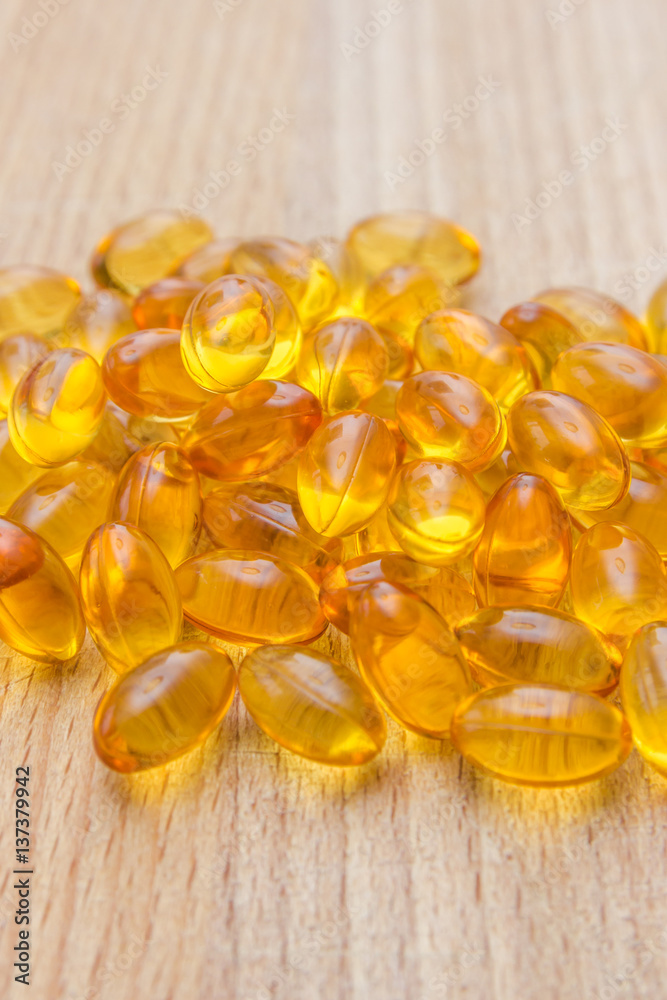 Fototapeta premium Fish oil capsules full of omega 3