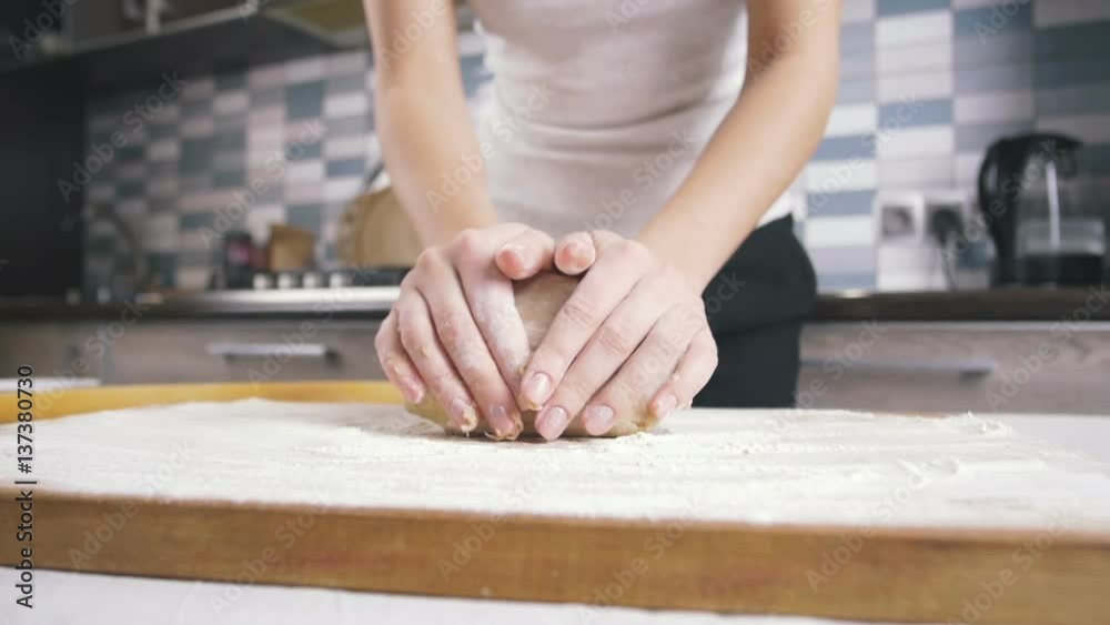 Making dough by female hands at home Making dough by female hands at home