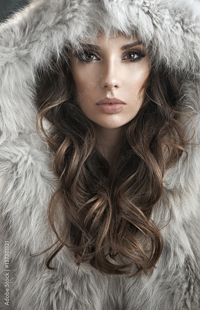 Portrait of an elegant woman wearing fur coat
