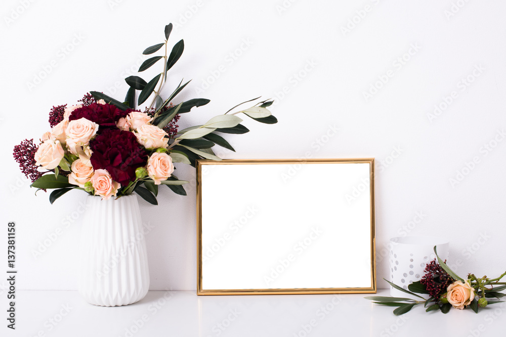 Golden frame mock-up on white wall Golden frame mock-up on white wall