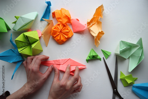 man doing origami photo