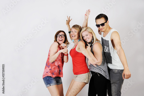 Happy young hipster group is joking and having a party. isolated on white background.