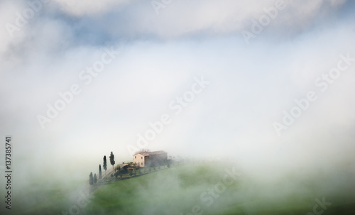 Glistening and beautiful fog on the Tuscan field