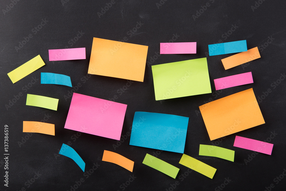 sticky note on the blank blackboard sticky note on the blank blackboard