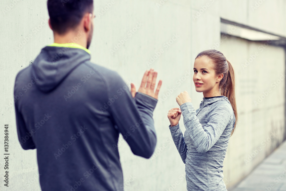 happy woman with coach working out strike outdoors happy woman with coach working out strike outdoors