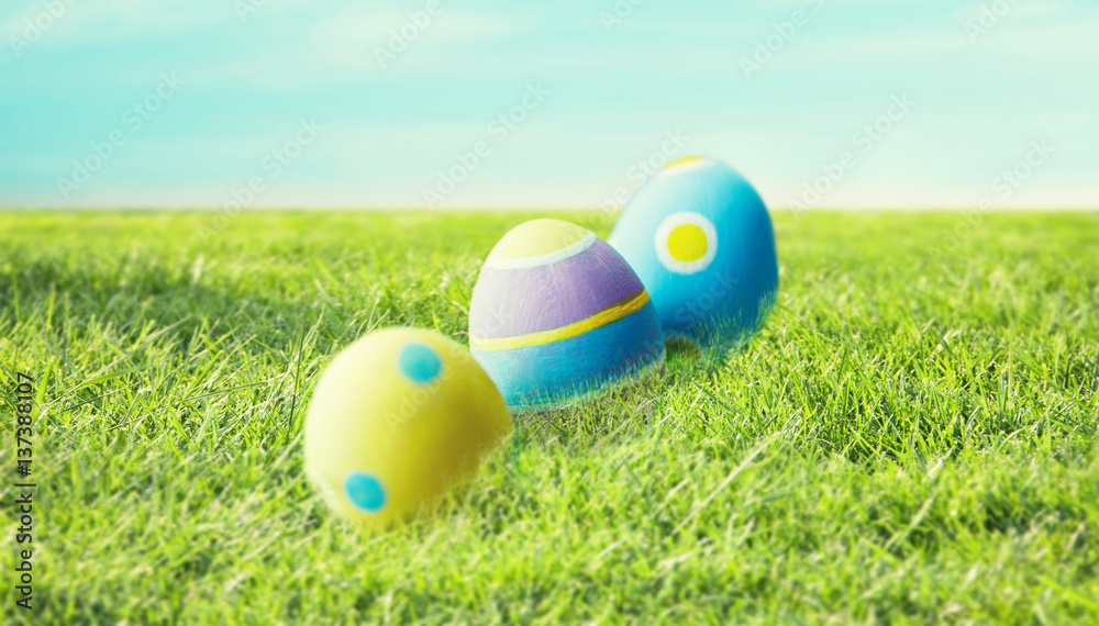 Fototapeta premium close up of colored easter eggs on grass