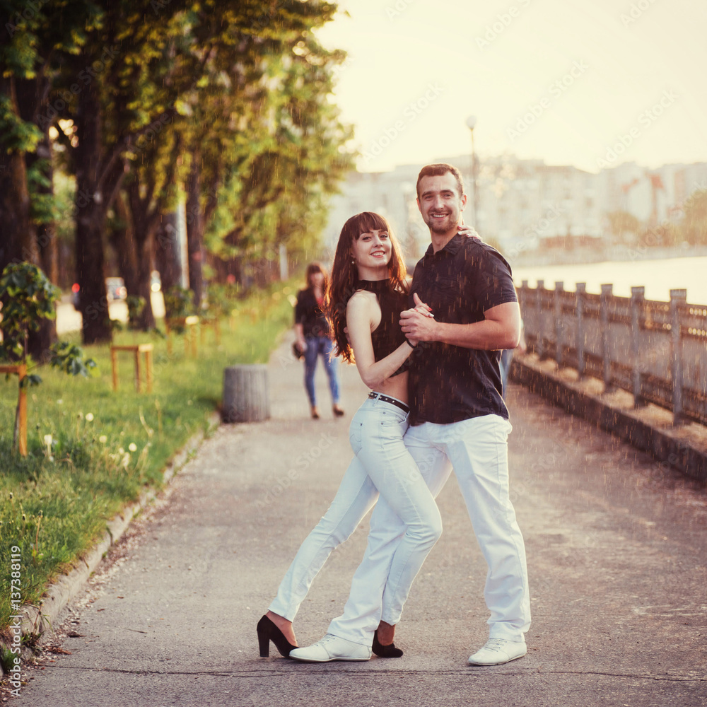 young couple dancing tango on the embankment young couple dancing tango on the embankment