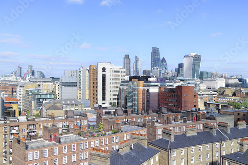 Photography City of London skyline, over the roofs of houses in south bank, showing skyscrapers in a square mile in the distance