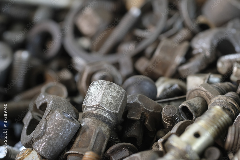 Background with the image of different close up bolts, screws and so on