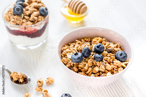 Healthy morning with granola breakfast on white kitchen table