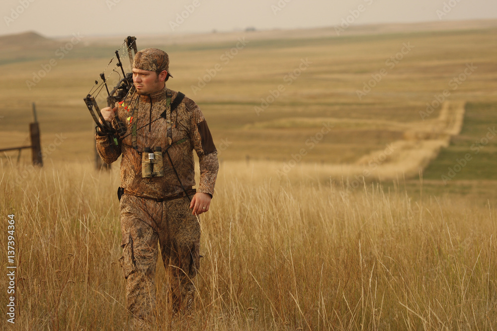 Antelope Bowhunter Walking Across Prairie Antelope Bowhunter Walking Across Prairie