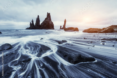 The Rock Troll Toes. Reynisdrangar cliffs. Black sand beach.