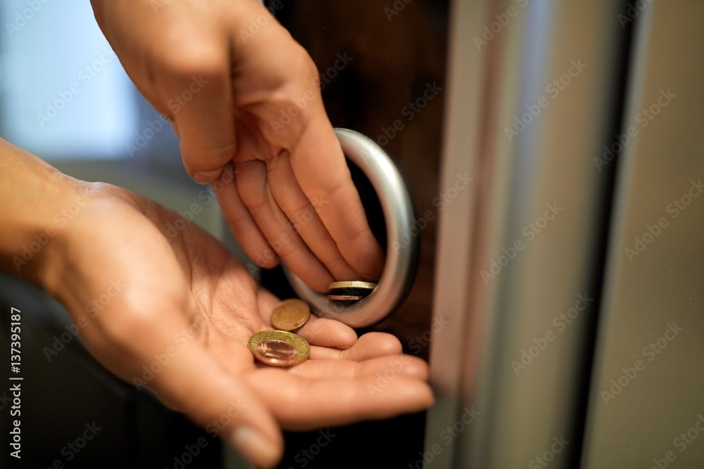 hands with euro coins at vending machine hands with euro coins at vending machine