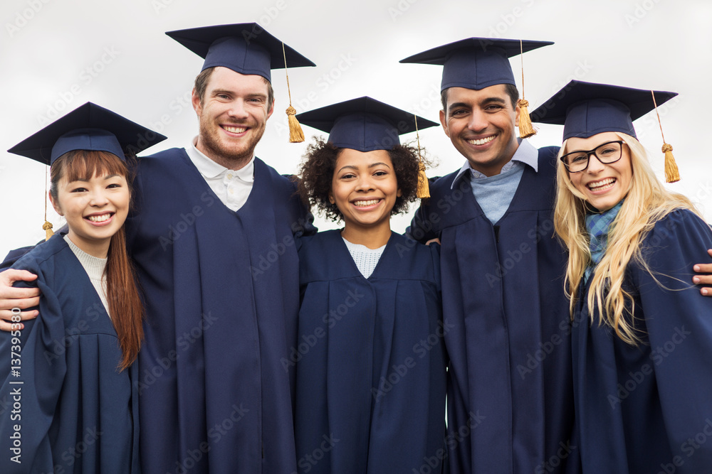 happy students or bachelors in mortar boards happy students or bachelors in mortar boards