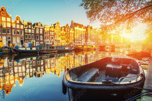 Canal at sunset. Amsterdam is the capital