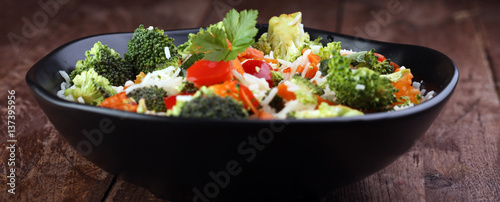 Colorful rice and vegetable salad - fresh mixed colorful healthy vegetarian food
