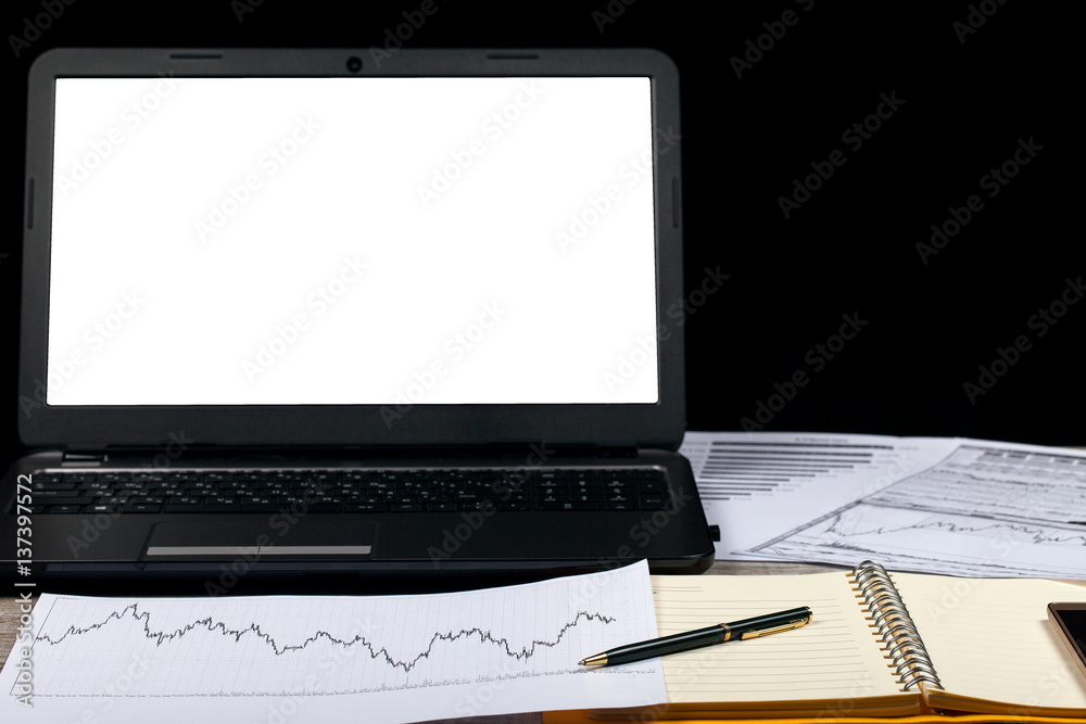 Open notebook, glasses, computer, pen and smartphone on a wooden table Open notebook, glasses, computer, pen and smartphone on a wooden table
