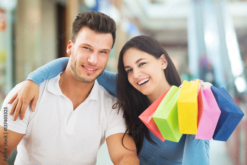 Smiling Couple In The Shopping Mall Smiling Couple In The Shopping Mall