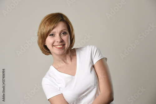 young beautiful red hair woman smiling happy and cheerful in friendly joyful face expression