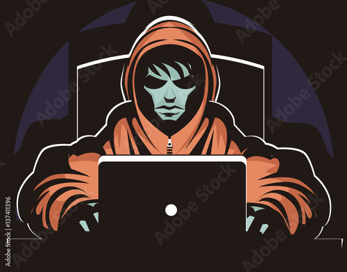 hacker stalker using a computer in the darkness