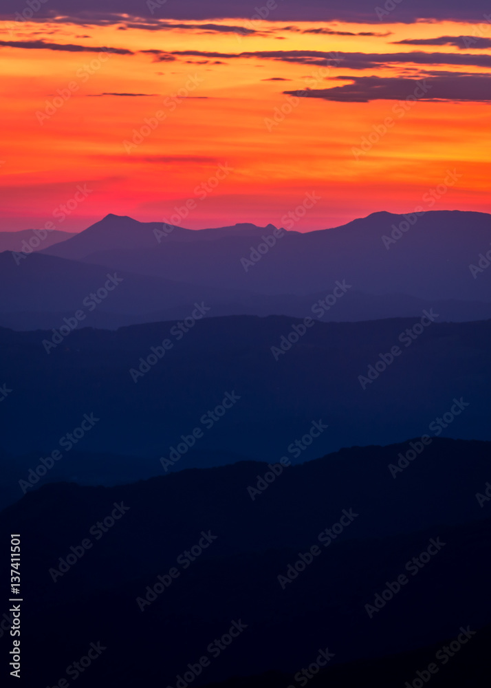 The morning light revealing the many layers of the peaks and ridges in the Blue Ridge Mountains along the Appalachian range The morning light revealing the many layers of the peaks and ridges in the Blue Ridge Mountains along the Appalachian range