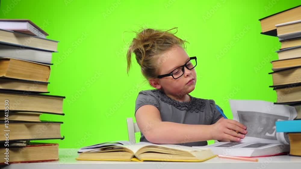 Girl leafing through the pages of books carefully. Green screen. Slow motion Girl leafing through the pages of books carefully. Green screen. Slow motion
