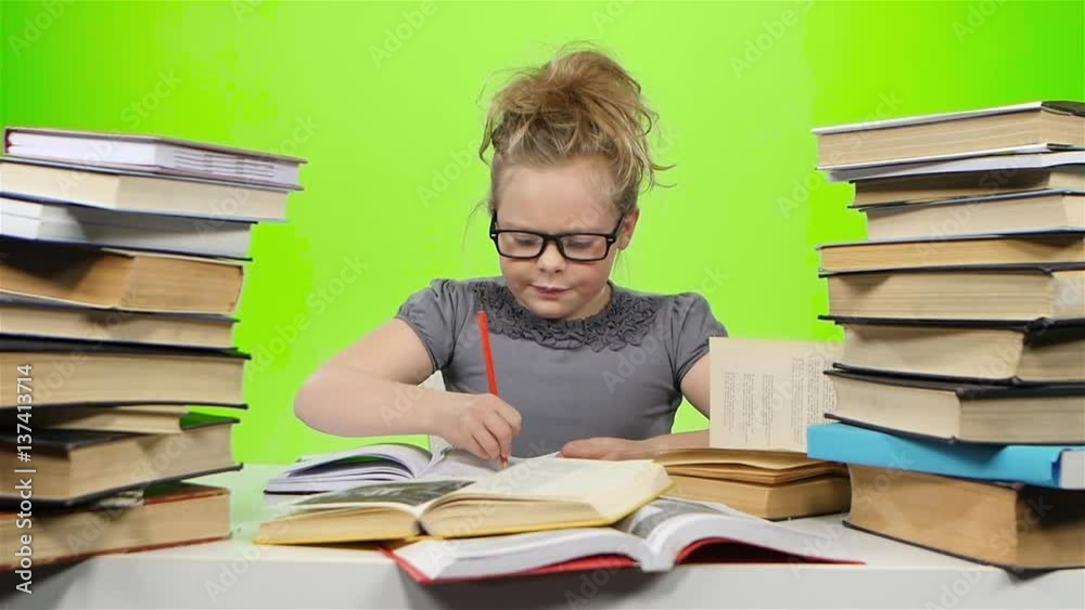 Girl nervously that writes in his notebook. Green screen. Slow motion