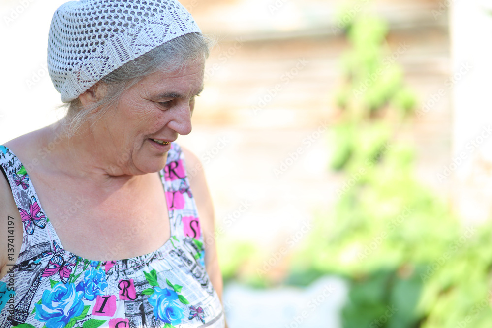an elderly woman in the garden outdoors