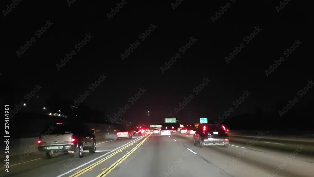 Driving on a road interstate 405 at night time, in Los angeles, California, in United states of America Driving on a road interstate 405 at night time, in Los angeles, California, in United states of America