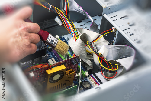 Maintenance and cleaning of the system unit of a personal computer.