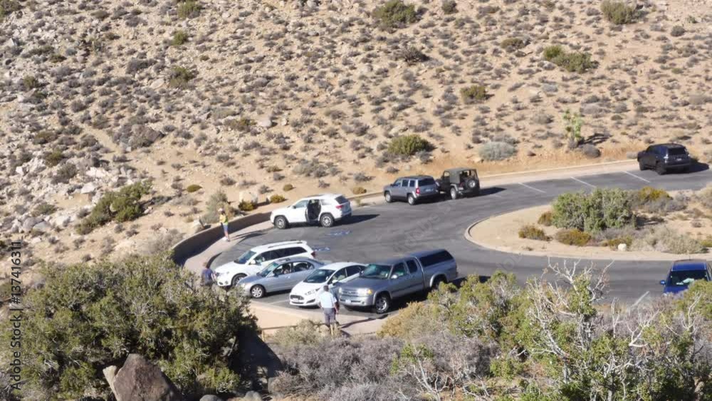 JOSHUA TREE, CALIFORNIA, UNITED STATES OF AMERICA, NOVEMBER 6 Time lapse of people at the parking lot at keys view, in Joshua tree national park, in California, United states of america