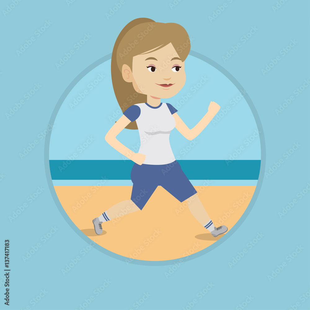 Young sporty woman jogging on the beach.