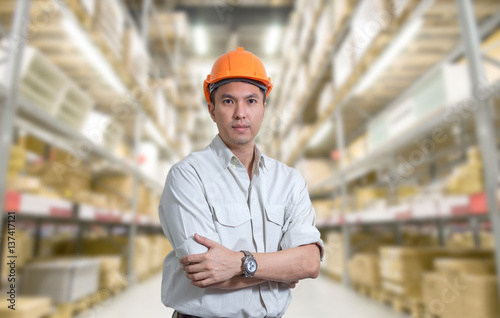 asian handsome store manager in warehouse