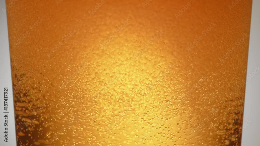 Extreme close-up beer in glass. Shot with high speed camera, phantom flex 4K. Slow Motion. Extreme close-up beer in glass. Shot with high speed camera, phantom flex 4K. Slow Motion.