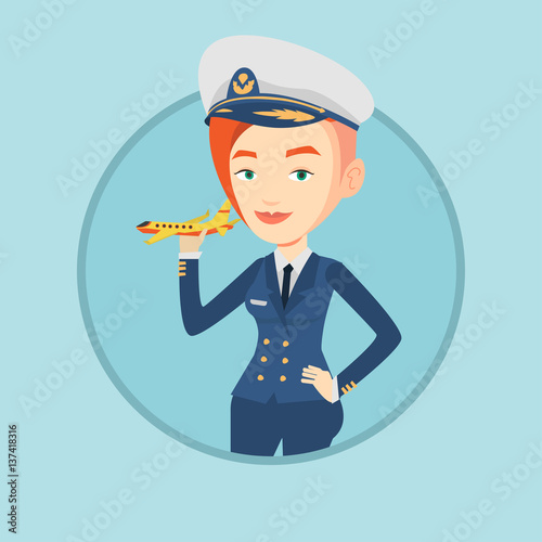 Cheerful airline pilot with model airplane.