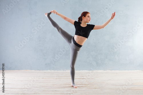 Young woman practicing yoga in a urban background. A series of yoga poses. Fitness, sport, yoga - concept.